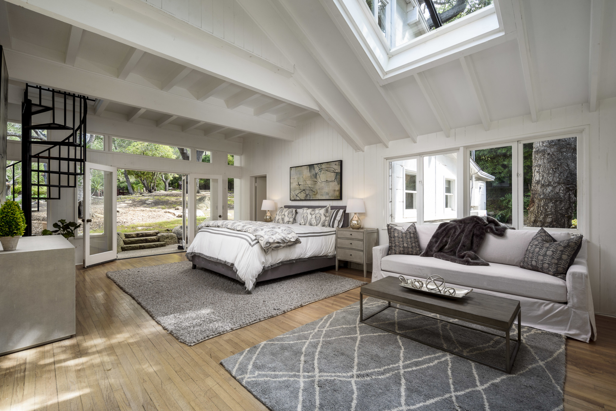 Spacious bedroom with many windows