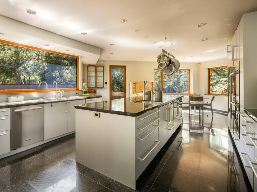 Custom Poggenpohl kitchen at The Erving House featuring European appliances and garden views.